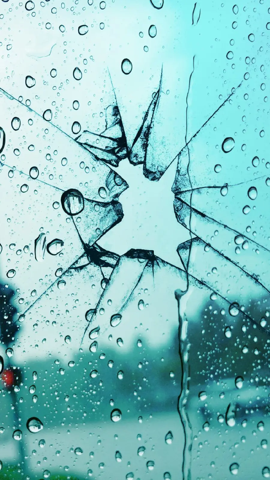 The latest photo of broken glass with a blue theme for the phone background