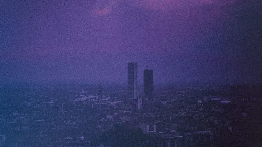 Latest stock photo of big city with hazy purple sky