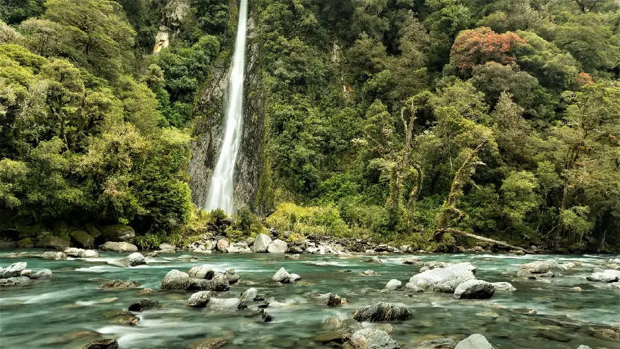 Beautiful image of a tall waterfall in the forest for computer backgrounds
