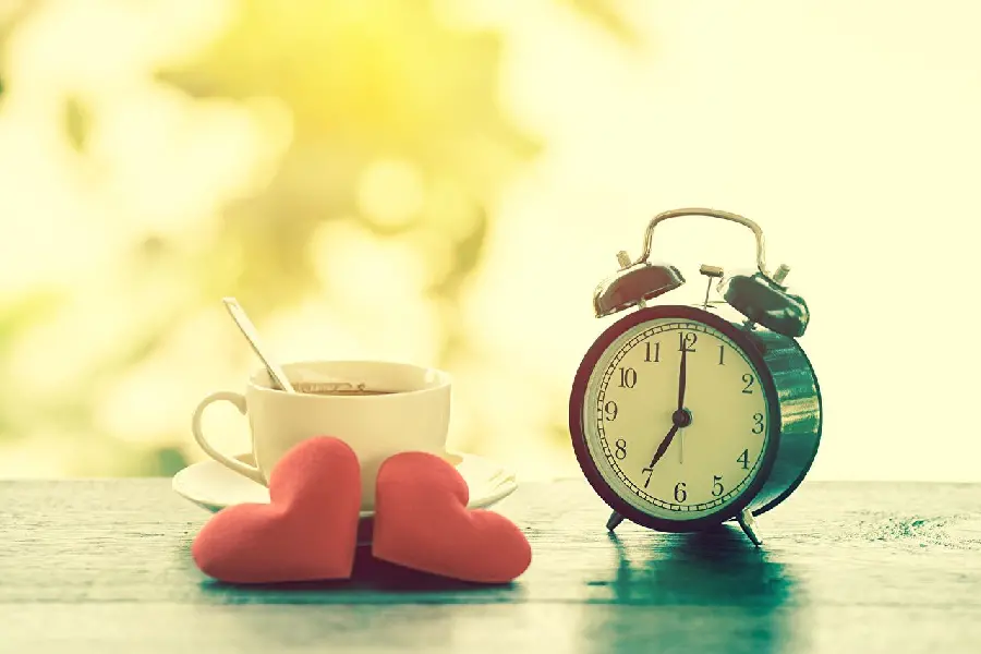 The latest romantic WhatsApp profile of a clock and a cup