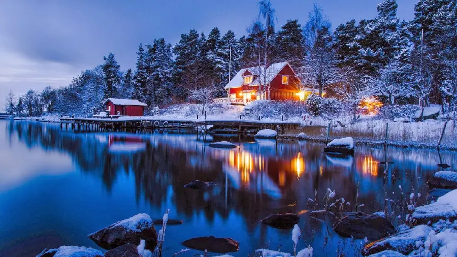 Charming Scandinavian Winter Scenery of a Snowy Village Near a Lake