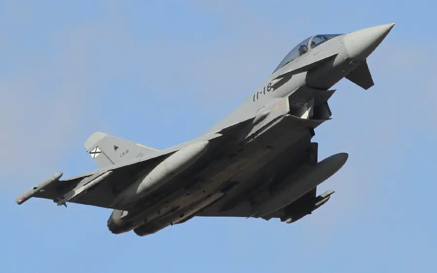 High-quality photo of a fighter aircraft in the blue sky for background
