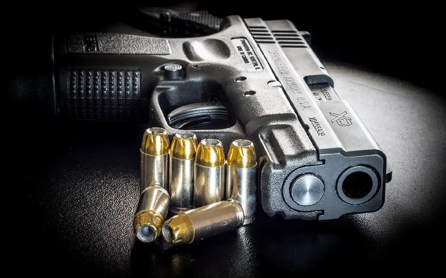 Download the Colt background image with magazine and bullets in HD quality