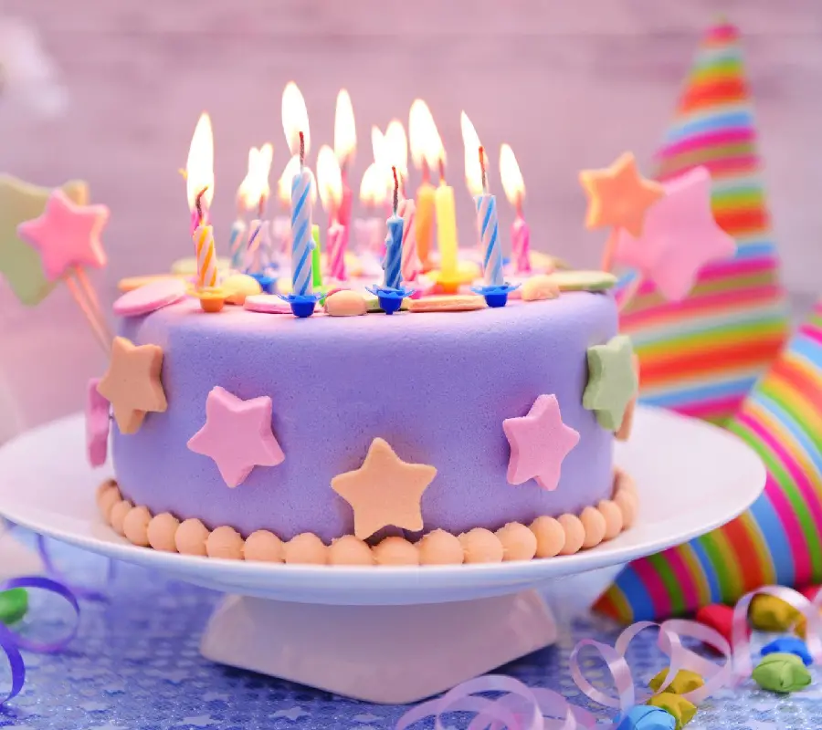Photo of a luxury birthday cake for a girl with beautiful colorful candles