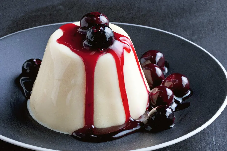 Tempting HD image of sweet milk pudding with a great cherry decoration