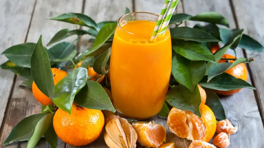 A hearty picture of a sweet mandarin fruit drink with special quality 