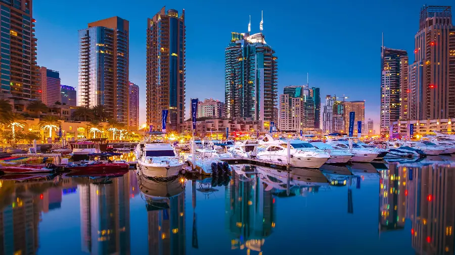 Photo of white pleasure boats in the modern city of Dubai 1402