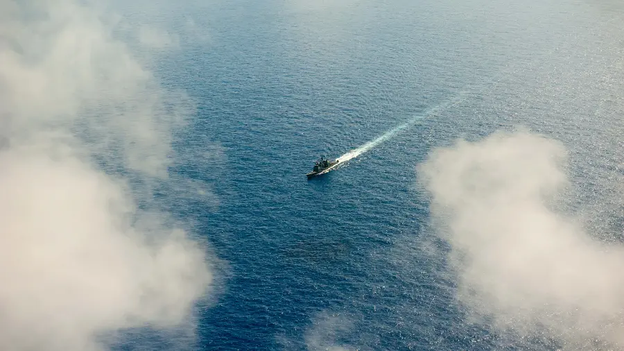 Beautiful image of a beautiful sea and a lonely boat in the middle of it for wallpaper
