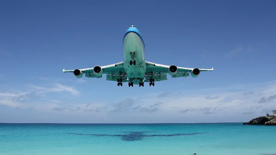 Dreamy Airplane Flight Image Over the Sea for Wallpaper