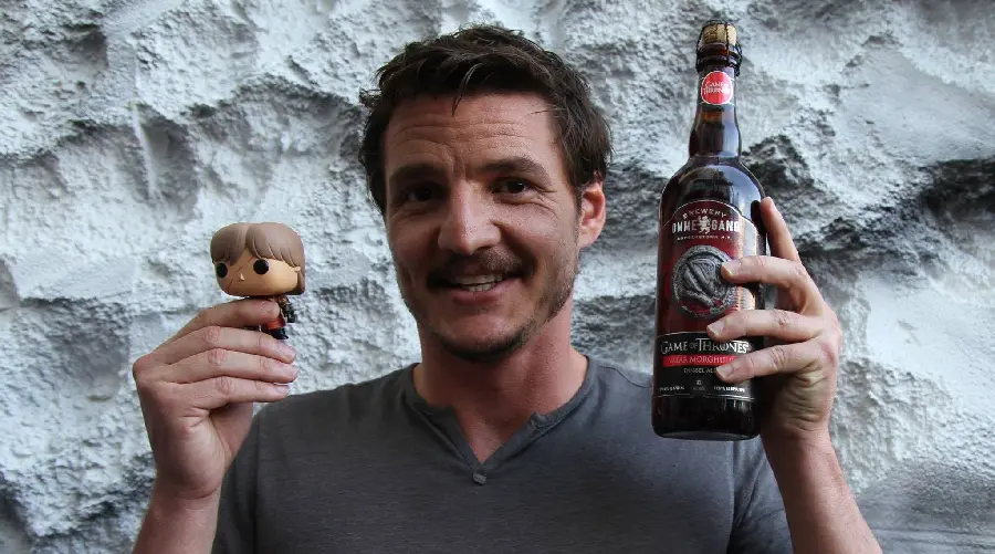 Pedro Pascal with a Game of Thrones doll and drink