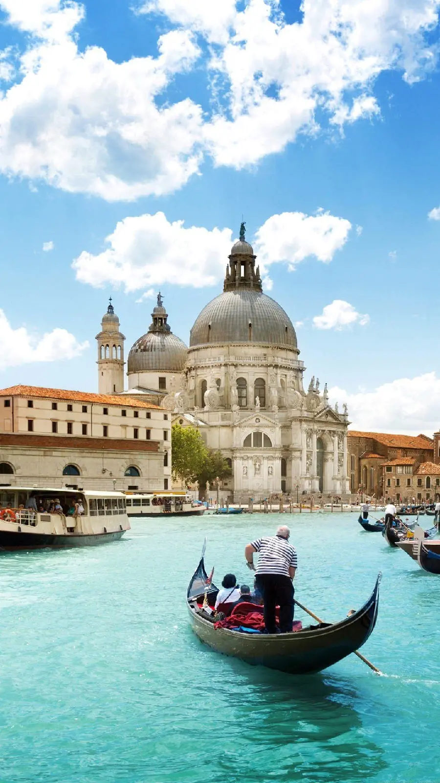 Photos of gondolas or small boats in the city of Venice, Italy