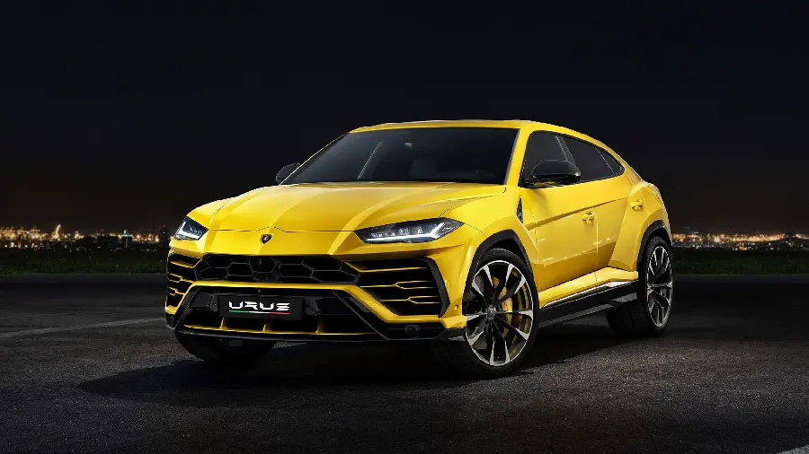 Beautiful yellow Lamborghini SUV with a black background