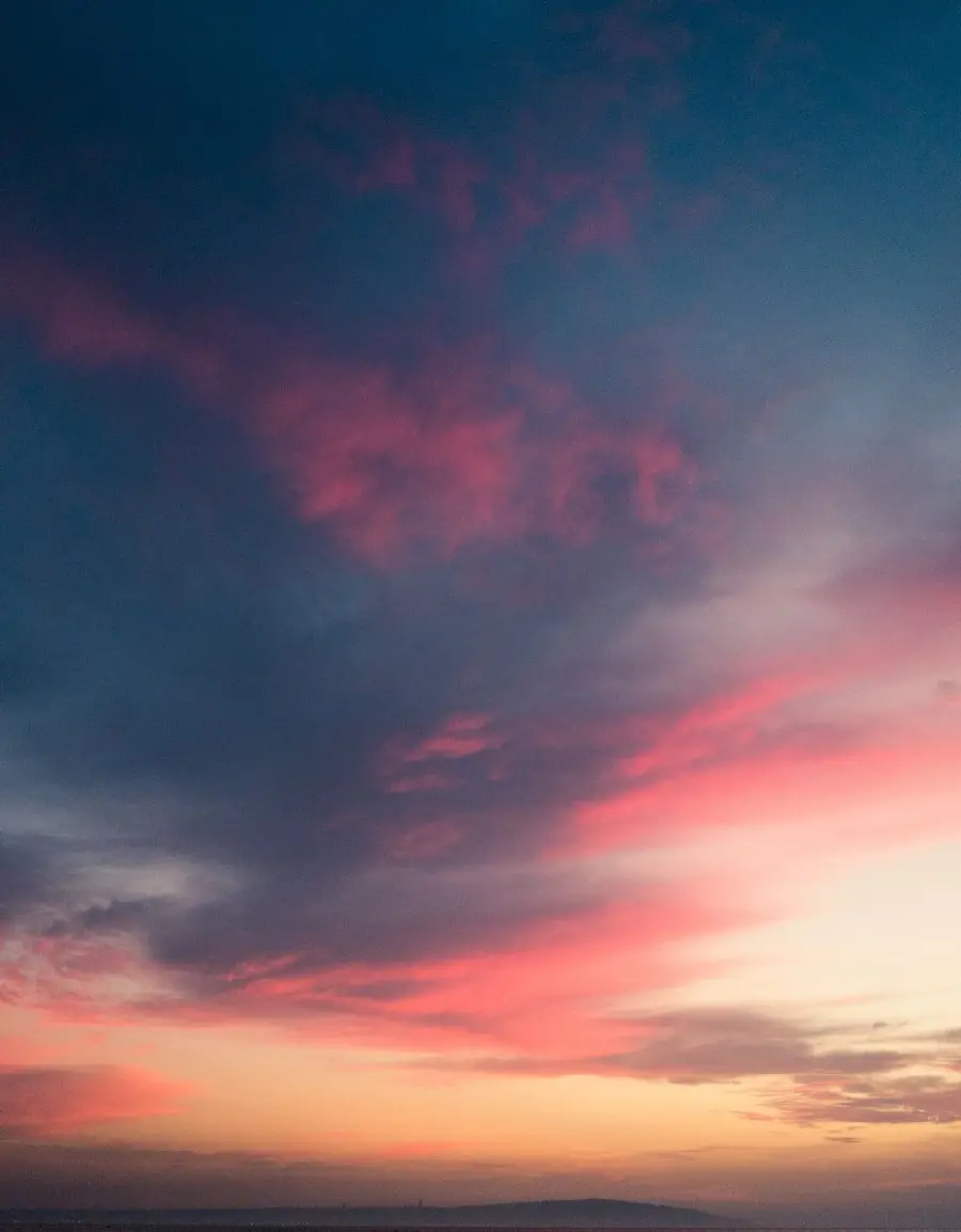 Download the latest iPhone wallpaper with eye-catching cloudy sky design