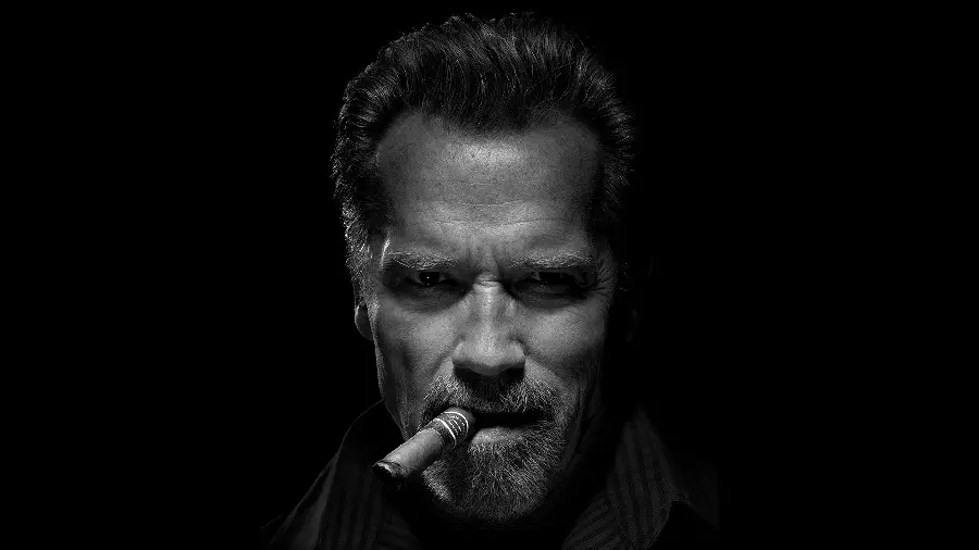 Stylish Boyish Wallpaper of a Powerful Man with a Cigarette in His Mouth for Computer Desktop