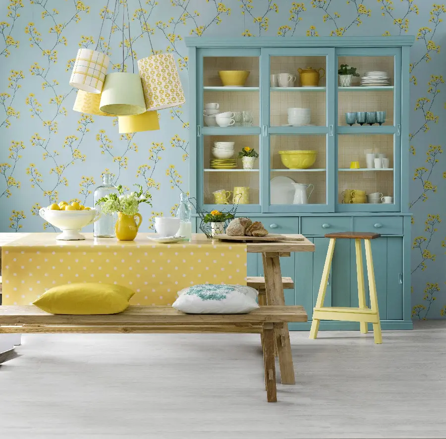  Beautiful photo of a kitchen with a blue cupboard and a beautiful yellow poster 