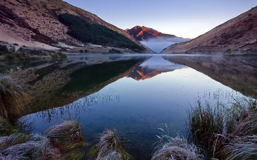 Unique and spectacular wallpaper of water next to high mountains and snow