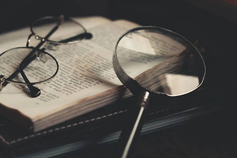  Attractive and beautiful image of a magnifying glass on a foreign book 