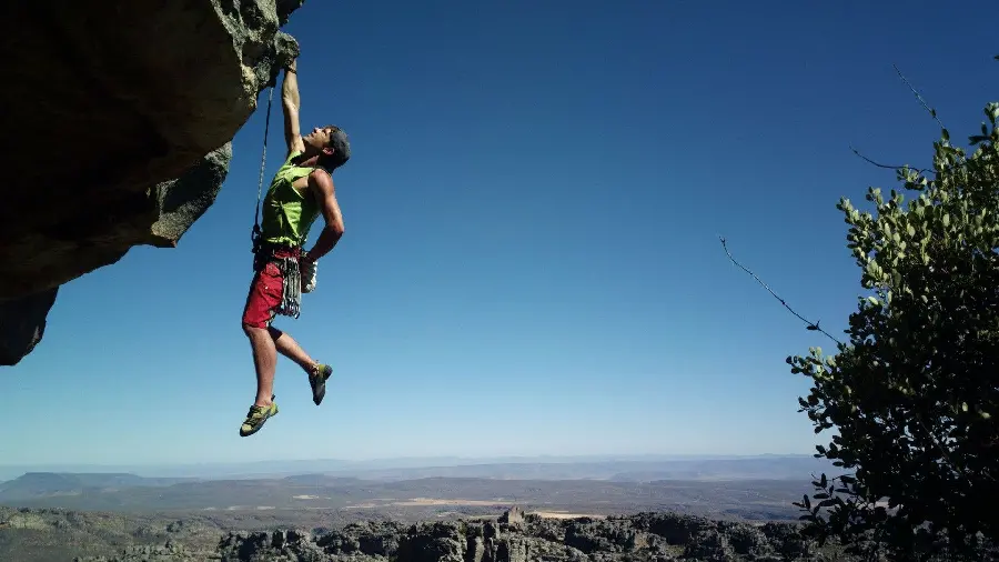 Strong rock climber stock photo for making a caption photo