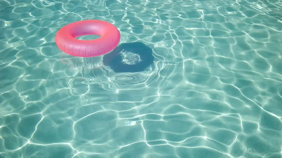 Download background photo of transparent pool and pink circular tube