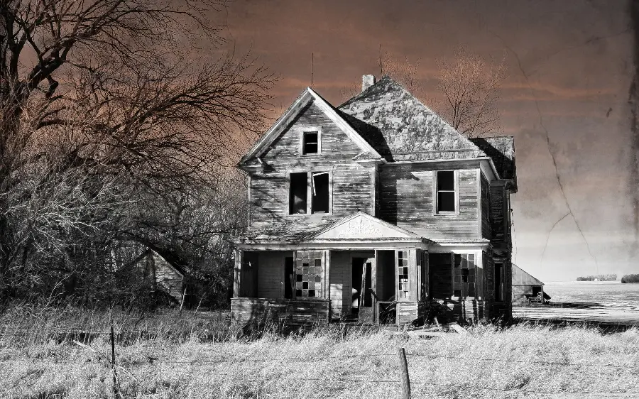 Background of an old abandoned wooden house with a gable roof