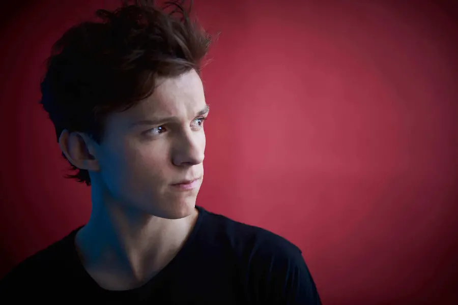Download a simple computer screen photo with the image of Tom Holland, the actor of the role of Spider-Man 