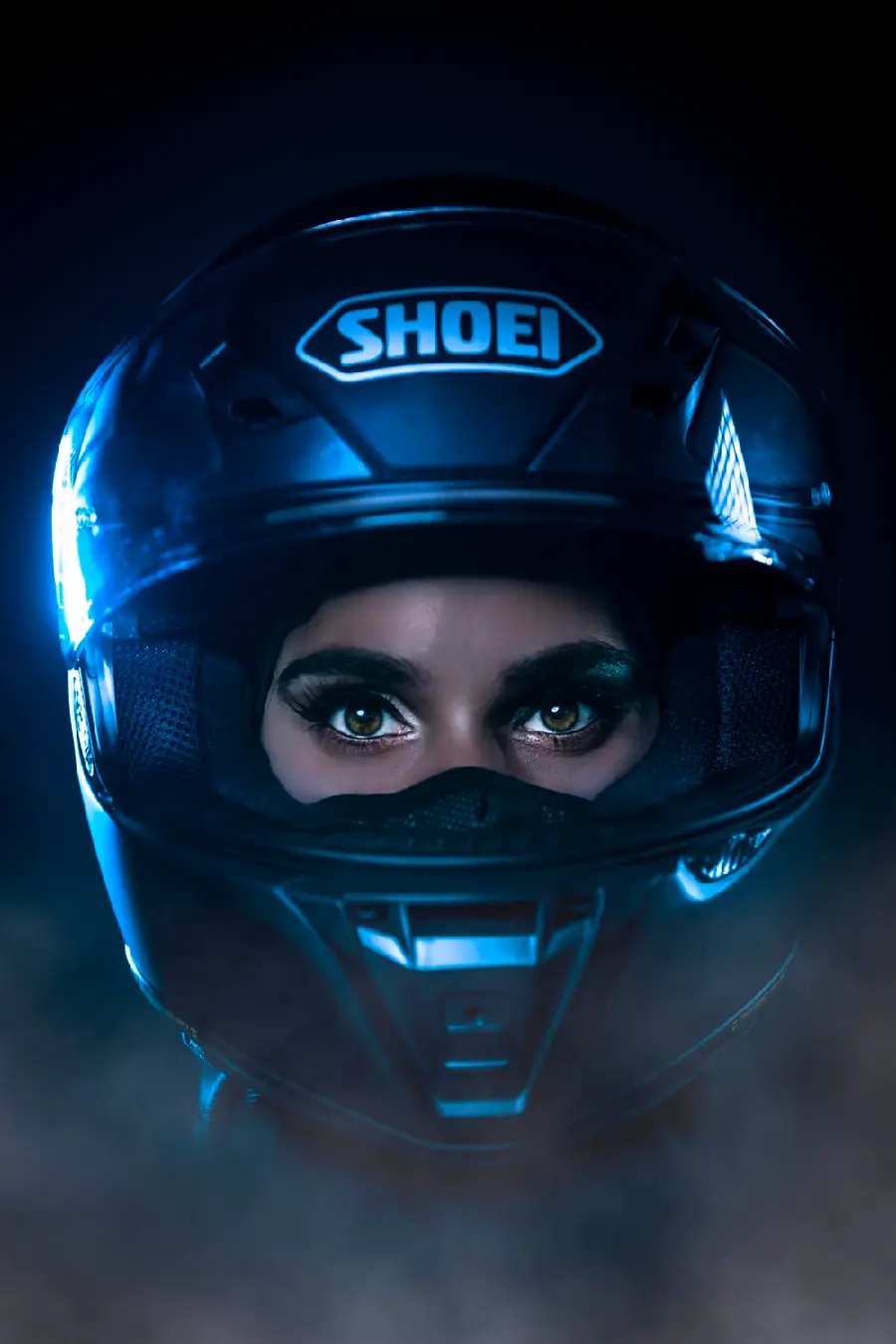 Full HD image of an attractive girl with green eyes and a professional helmet