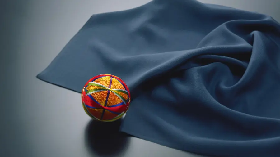 Artistic quality photo of crumpled fabric with colorful balls