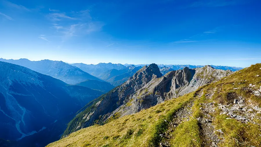 Unique and spectacular wallpaper of a tall and lush mountain 