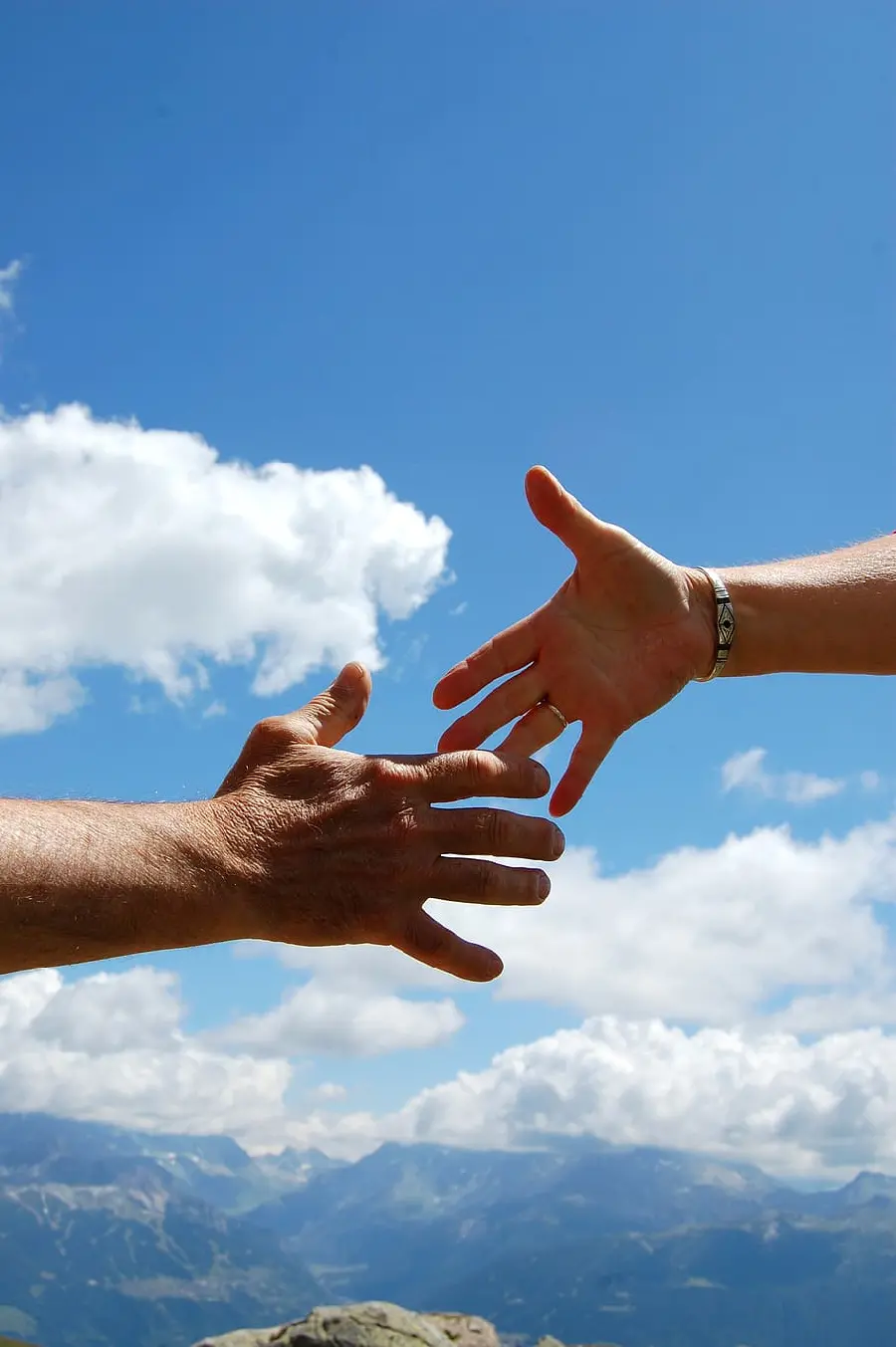 High quality photo of handshake with sky background suitable for the first slide of the project 