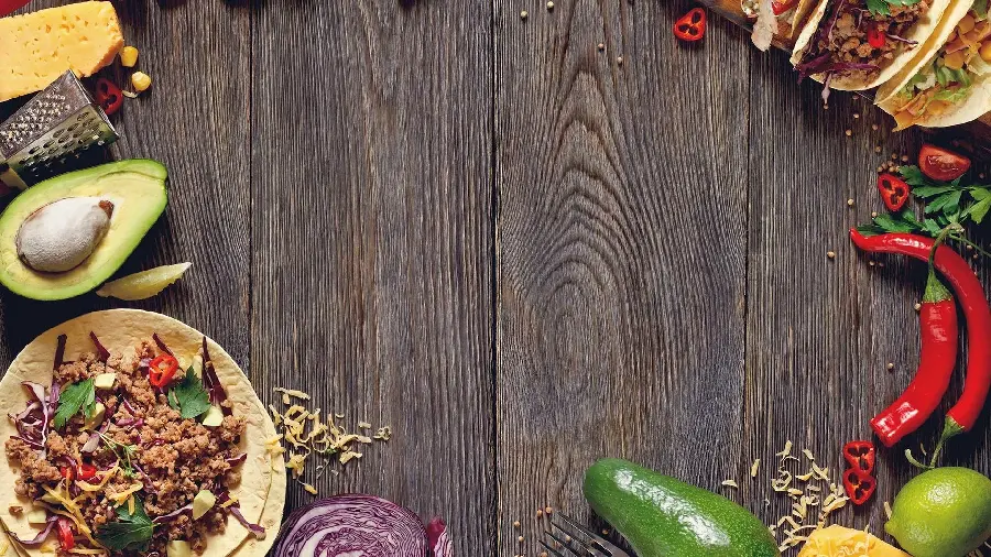 Awesome photo of various Mexican foods with wooden background
