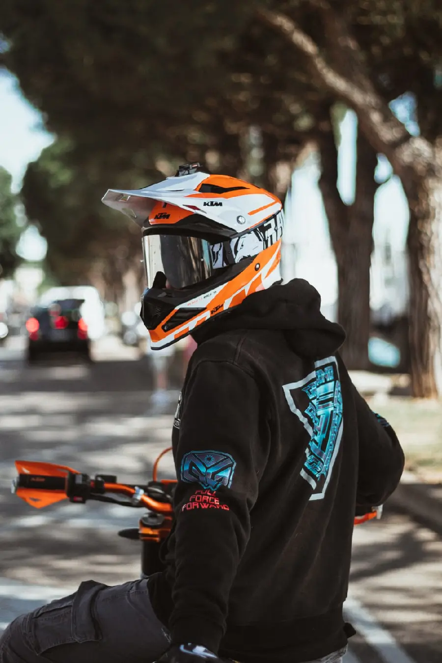 Fake story of a boy with a hoodie and a helmet on a motorcycle for Instagram