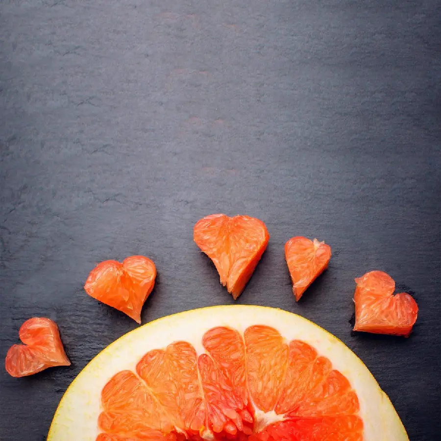 Cute background photo of grapefruit and little hearts from palettes
