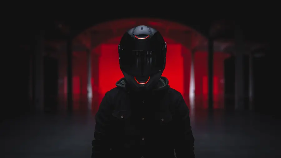 Luxurious red and black photo of a motorcyclist suitable for Instagram posts