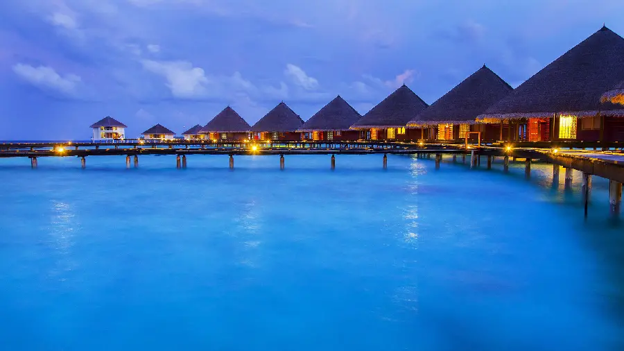 Stock photo of wooden bridge over the blue sea with a gazebo