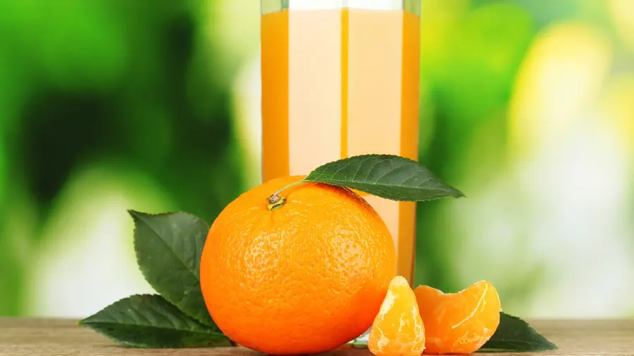 Delicious and juicy background image of natural orange juice 