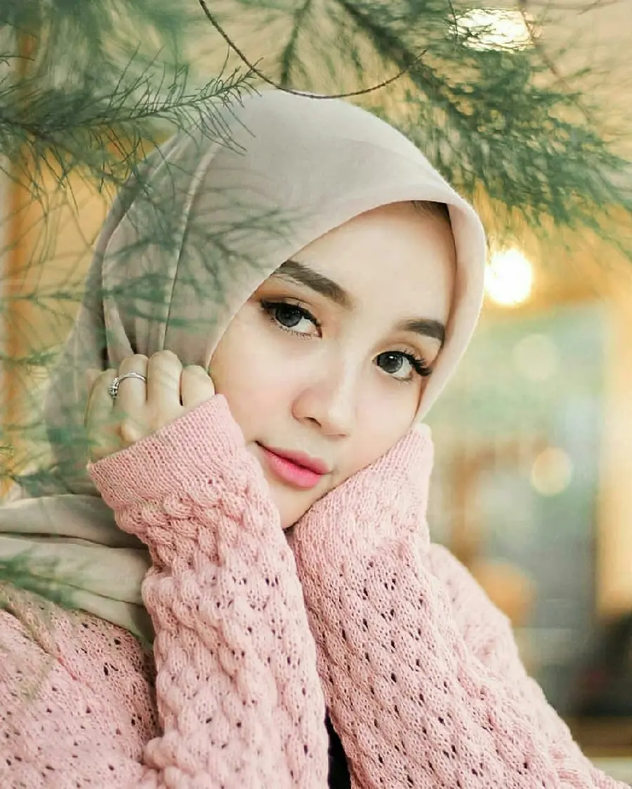 Background of a beautiful white girl with a hijab in a beautiful warm dress