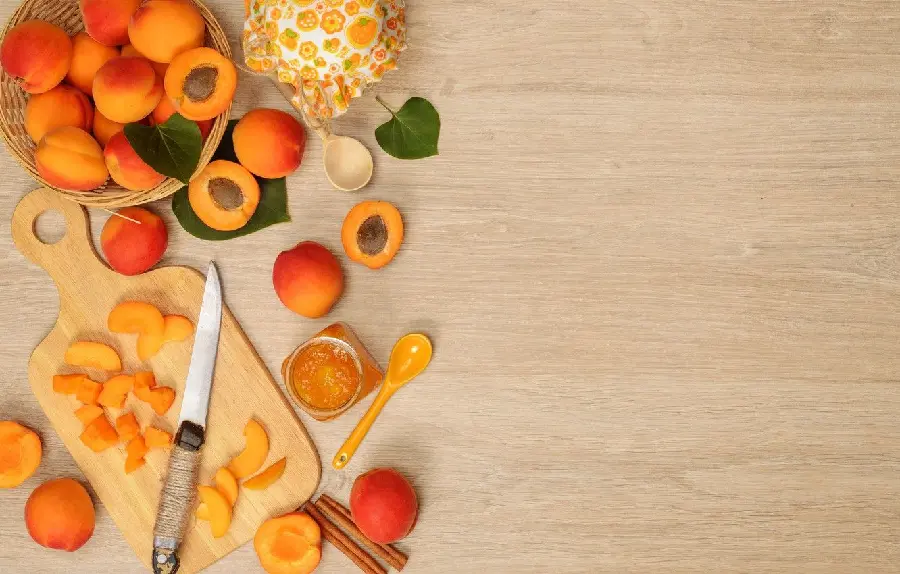 Beautiful image of an arrangement of apricots and their jam in high quality 