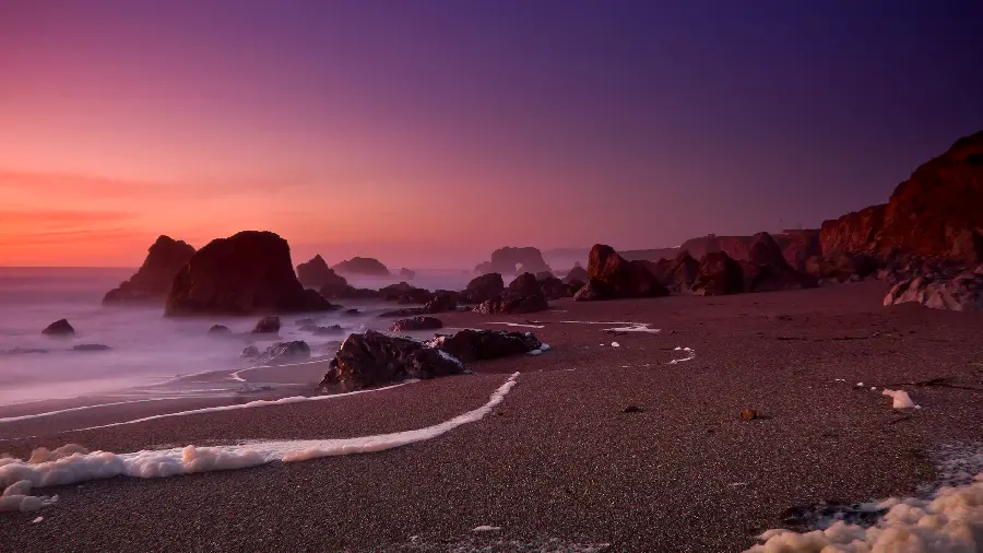 Spectacular and beautiful photo Seashore at sunset orange and purple sun