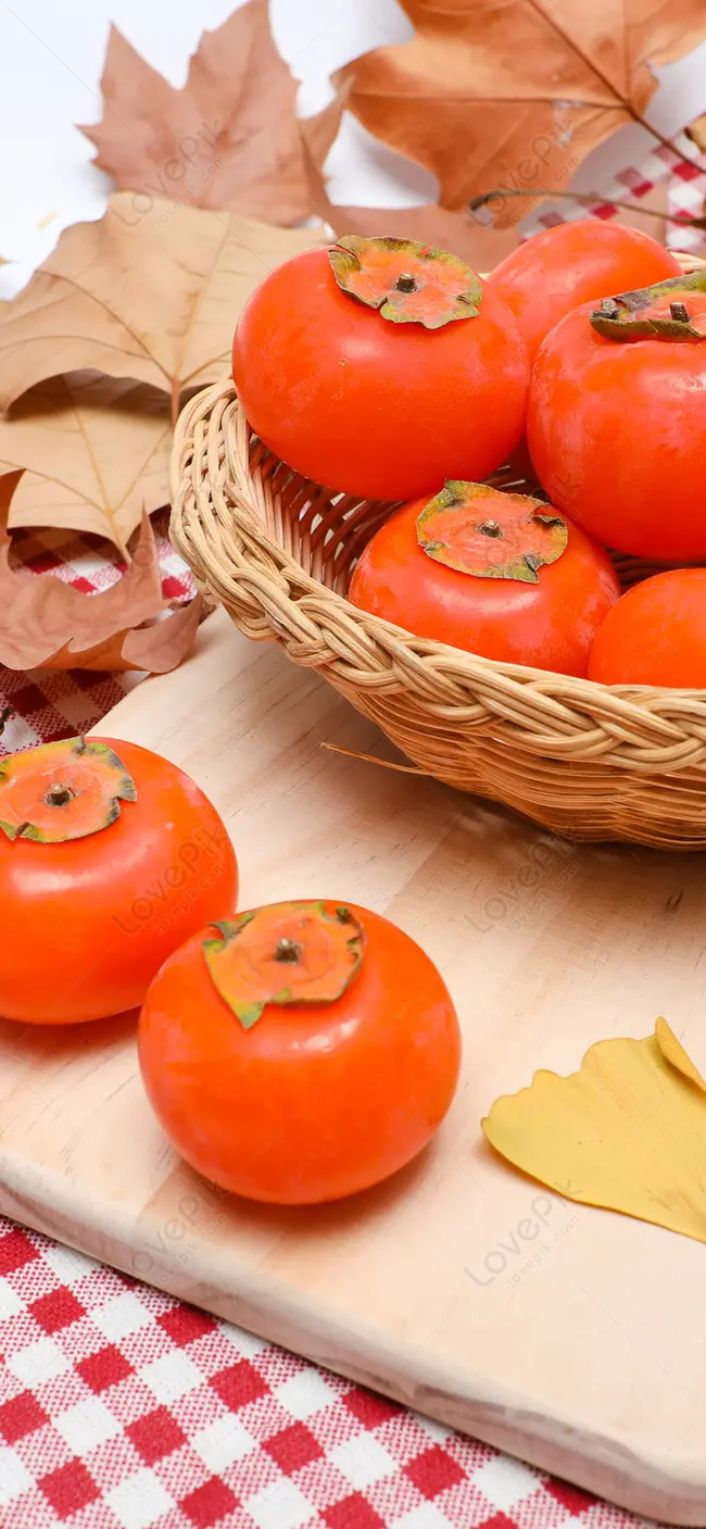 Stock Photo of Orange Persimmons on Wooden Stand and Basket