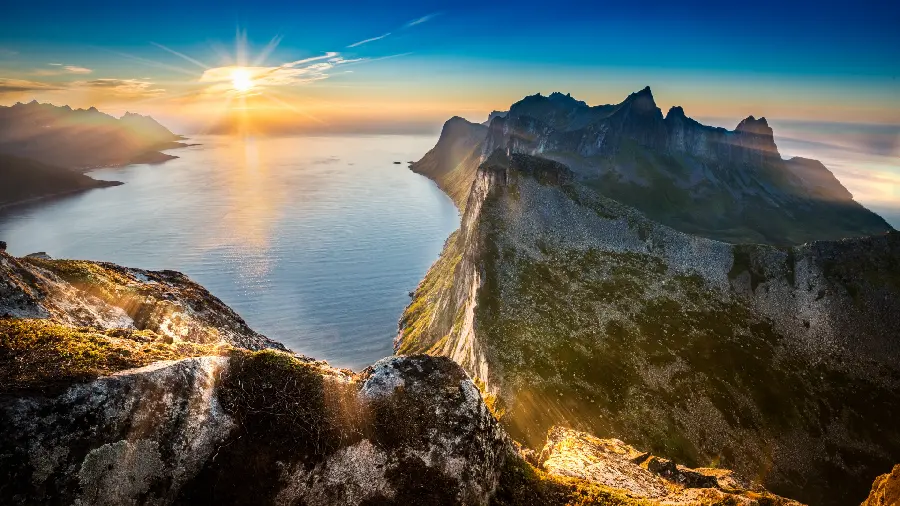 Download a wonderful picture of a very beautiful mountain view by the water with a sunset 