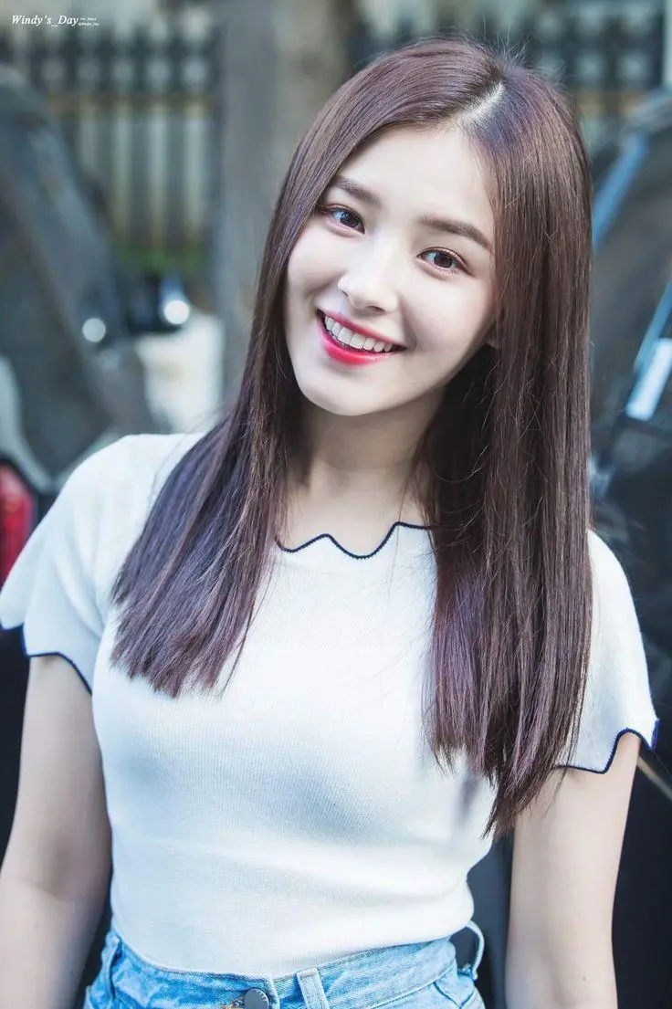 Profile photo of Nancy with a white T-shirt and a smiling face