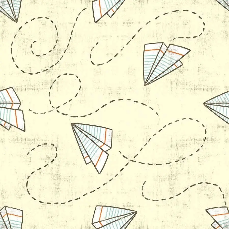 Photo of a paper rocket with lined paper on a pale yellow page, cute