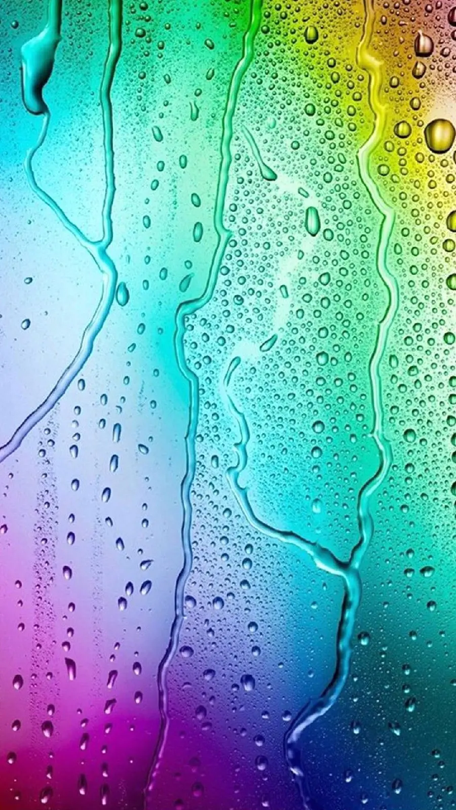 Dreamy background photo of liquid drops on rainbow glass for mobile