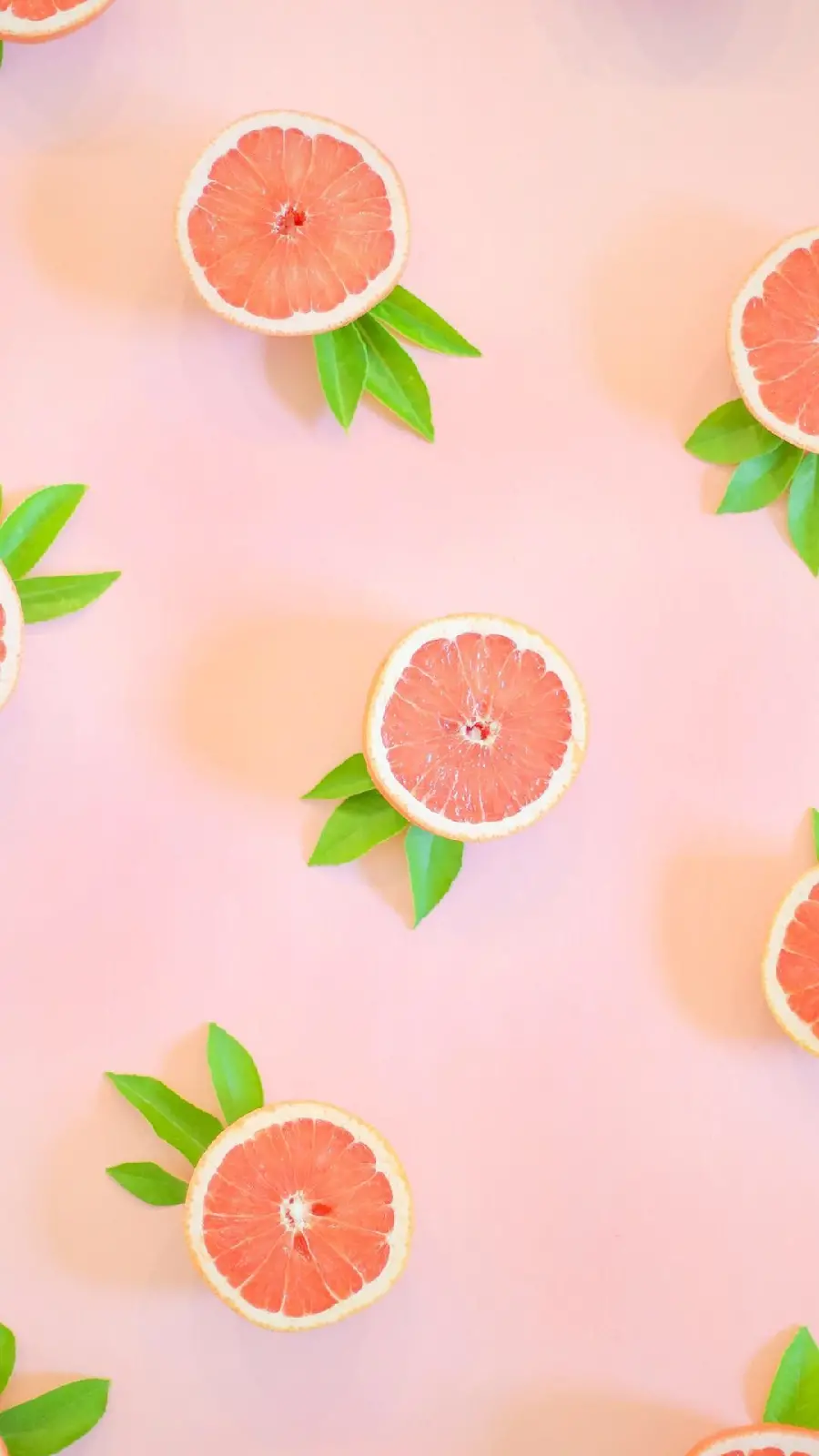 Beautiful pink grapefruit wallpaper with a pink background