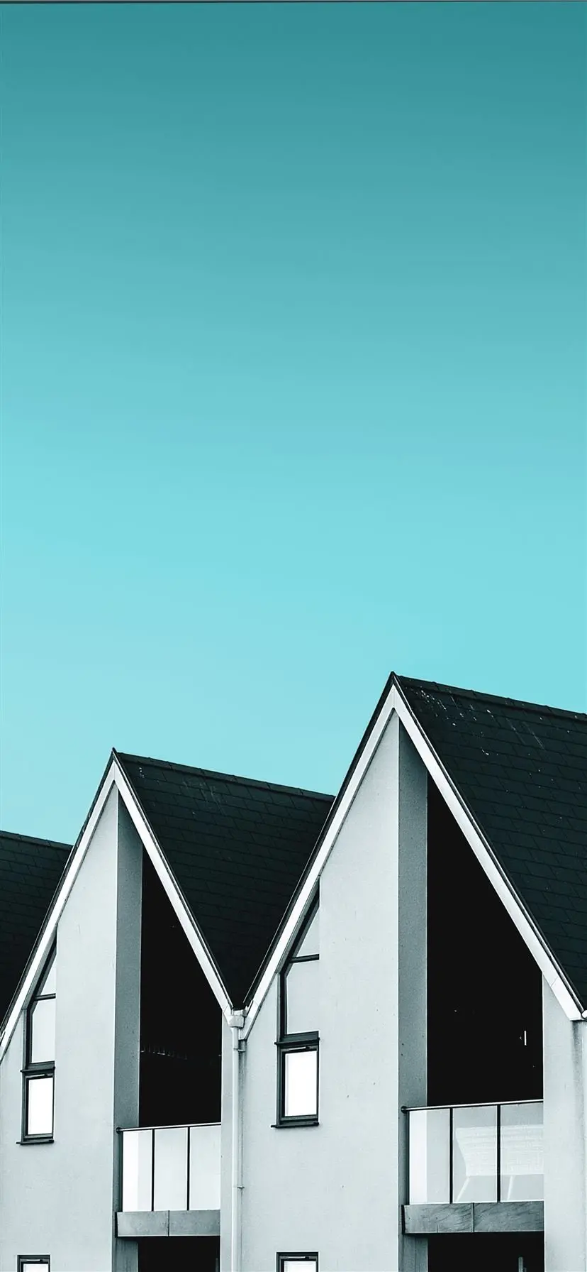 A very interesting and spectacular wallpaper of three houses with sloping roofs 