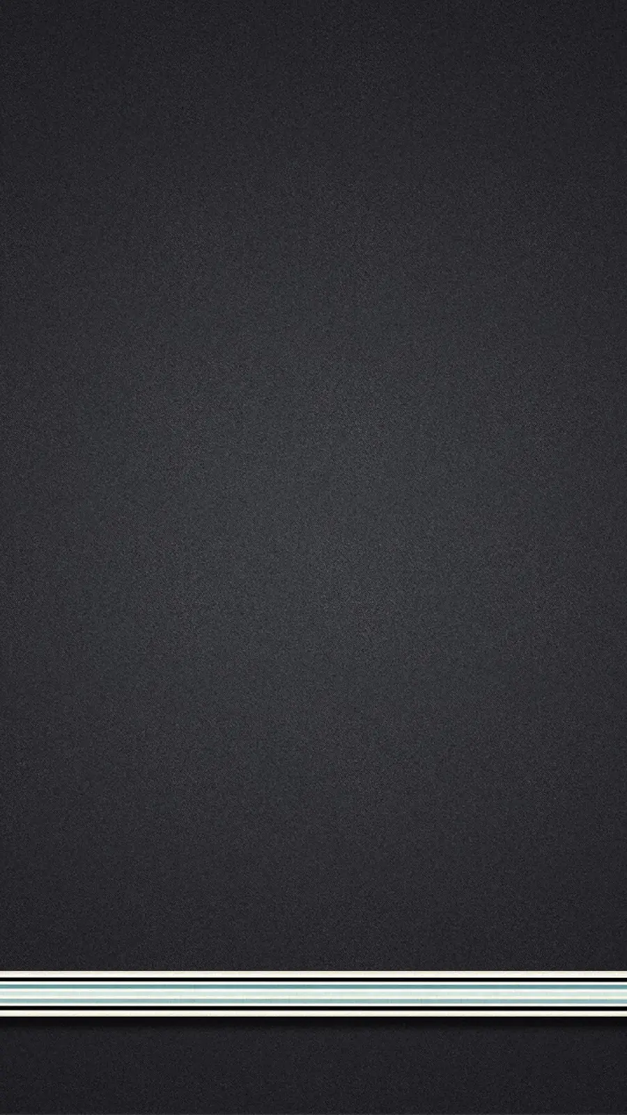 Simple gray texture photo with a narrow strip in white, black and blue at the bottom