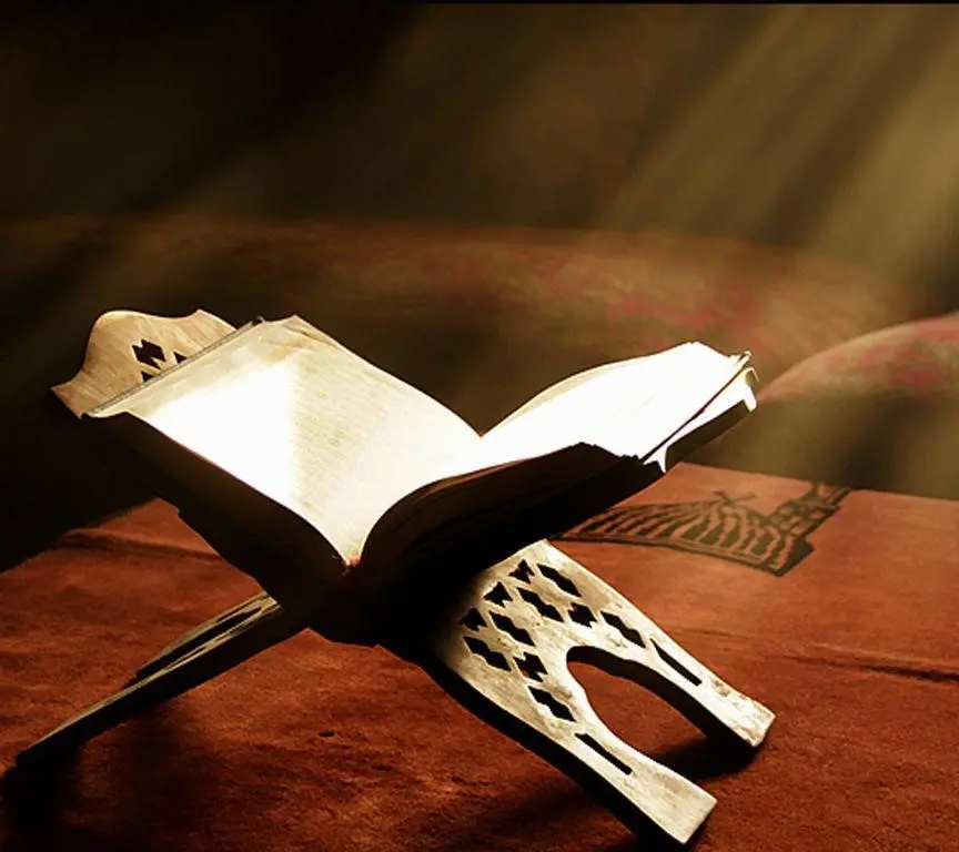 A very beautiful photo of the Quran with a light in front of it