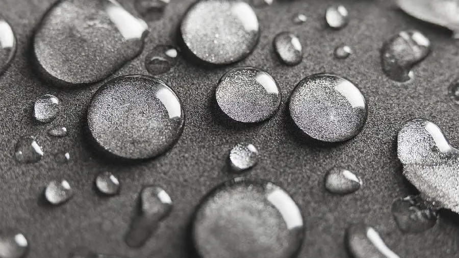 A very beautiful wallpaper of water drops on a gray background 