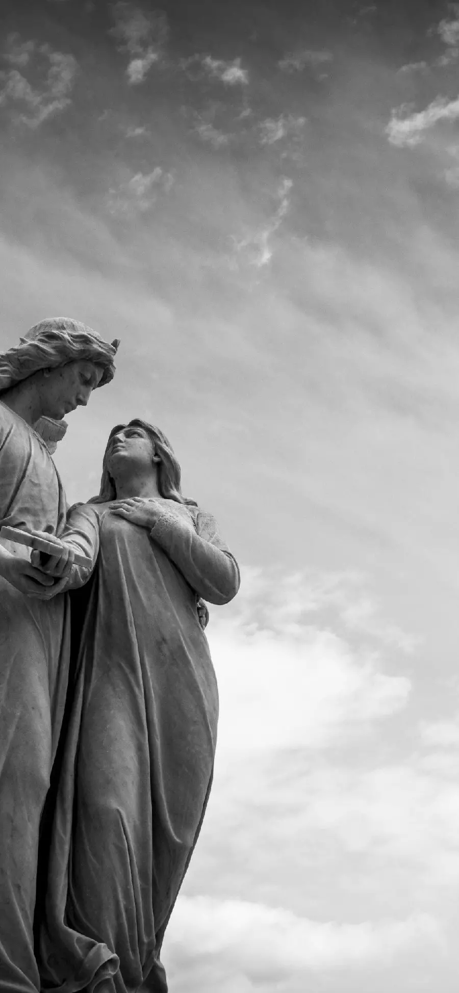 Black and White Image of a Winged Angel Stone Statue in Full HD Quality