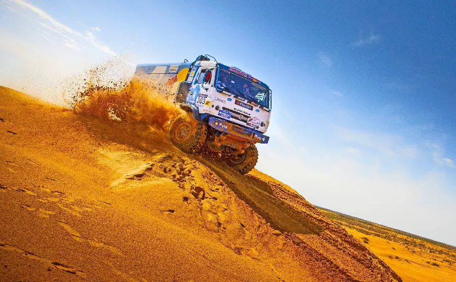 Download the free and amazing image of the Dakar Rally with the popular Red Bull team truck company